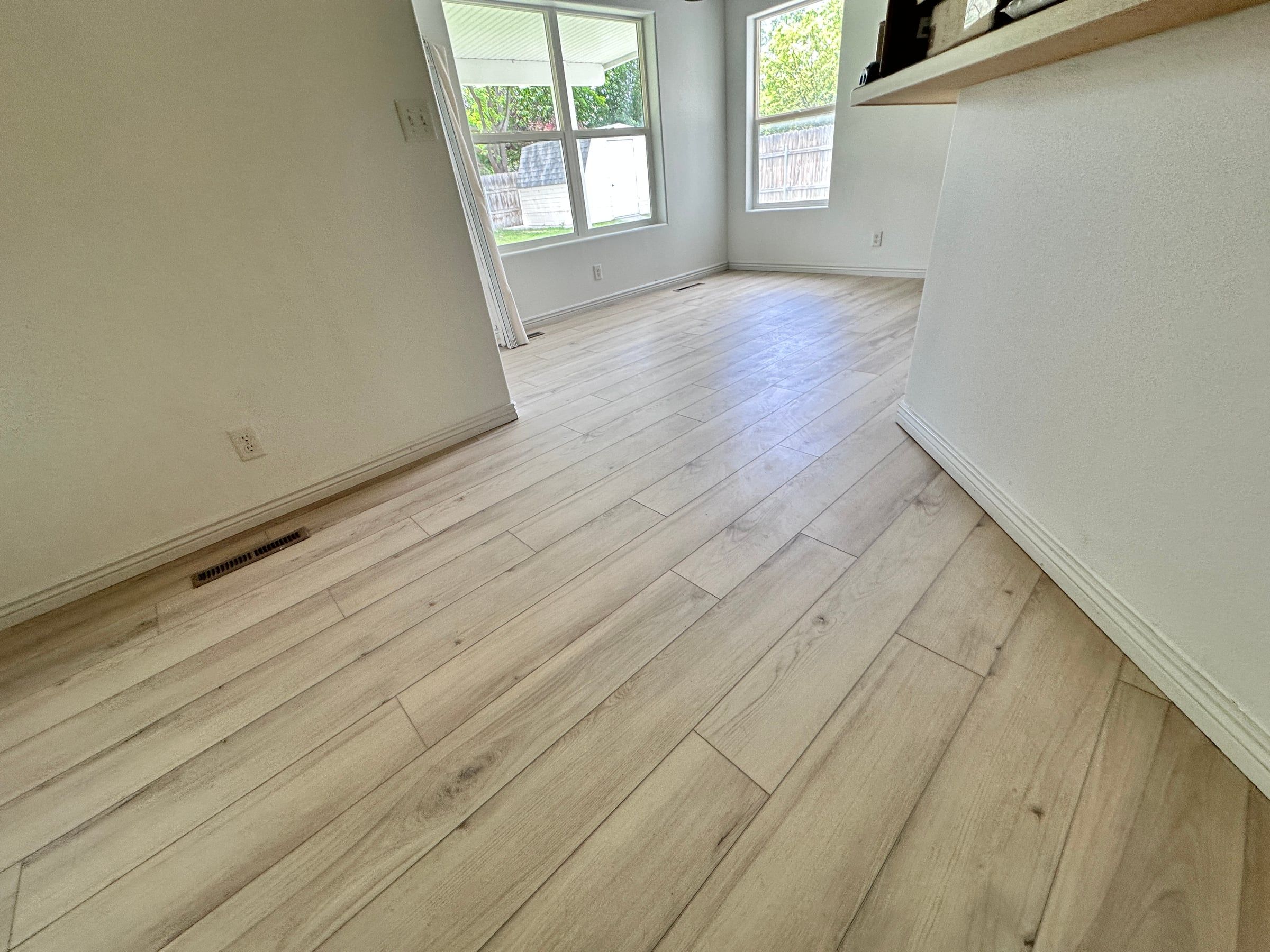 Light luxury vinyl plank flooring in a bright living room