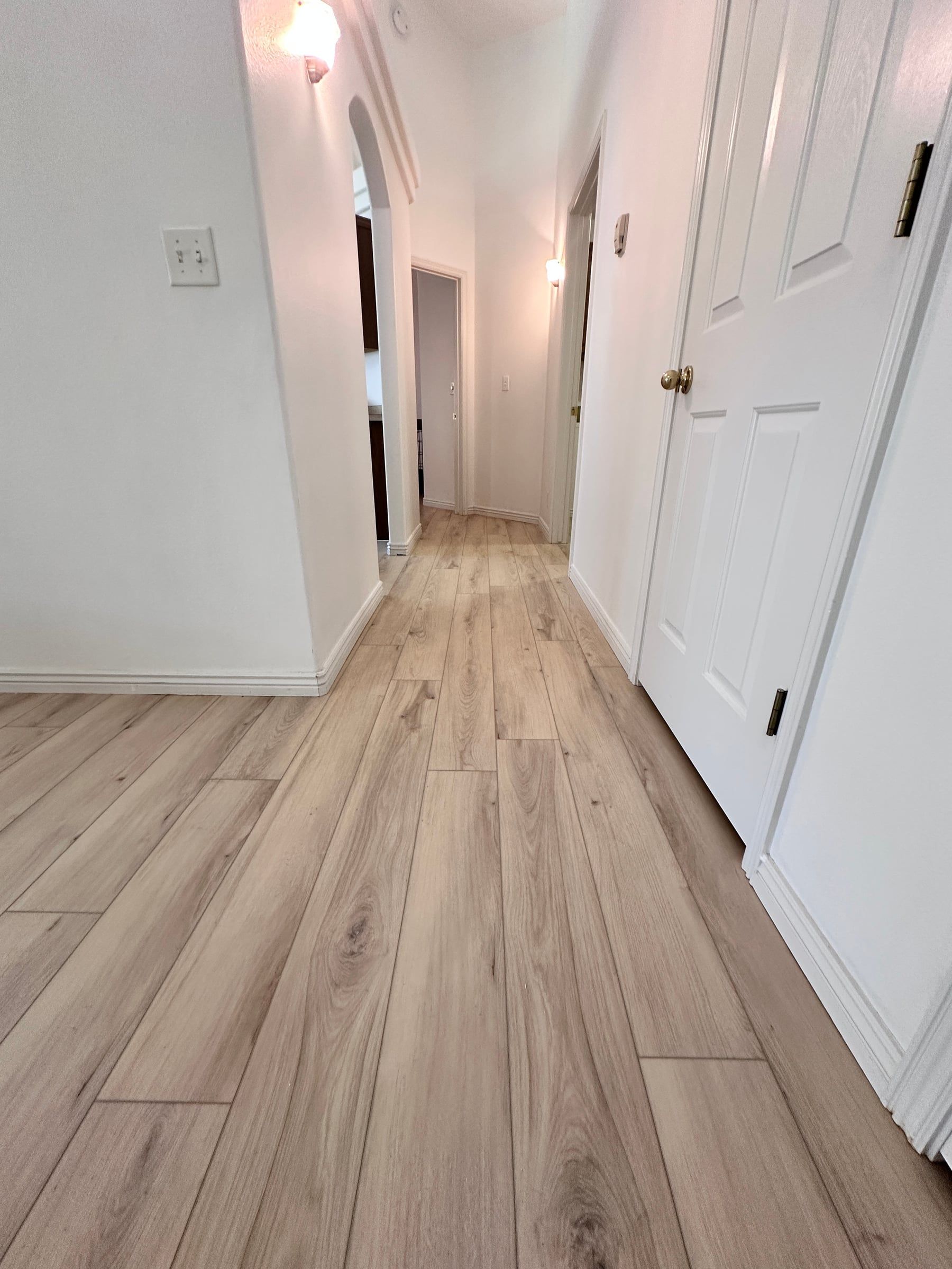 Light luxury vinyl plank running down a hallway