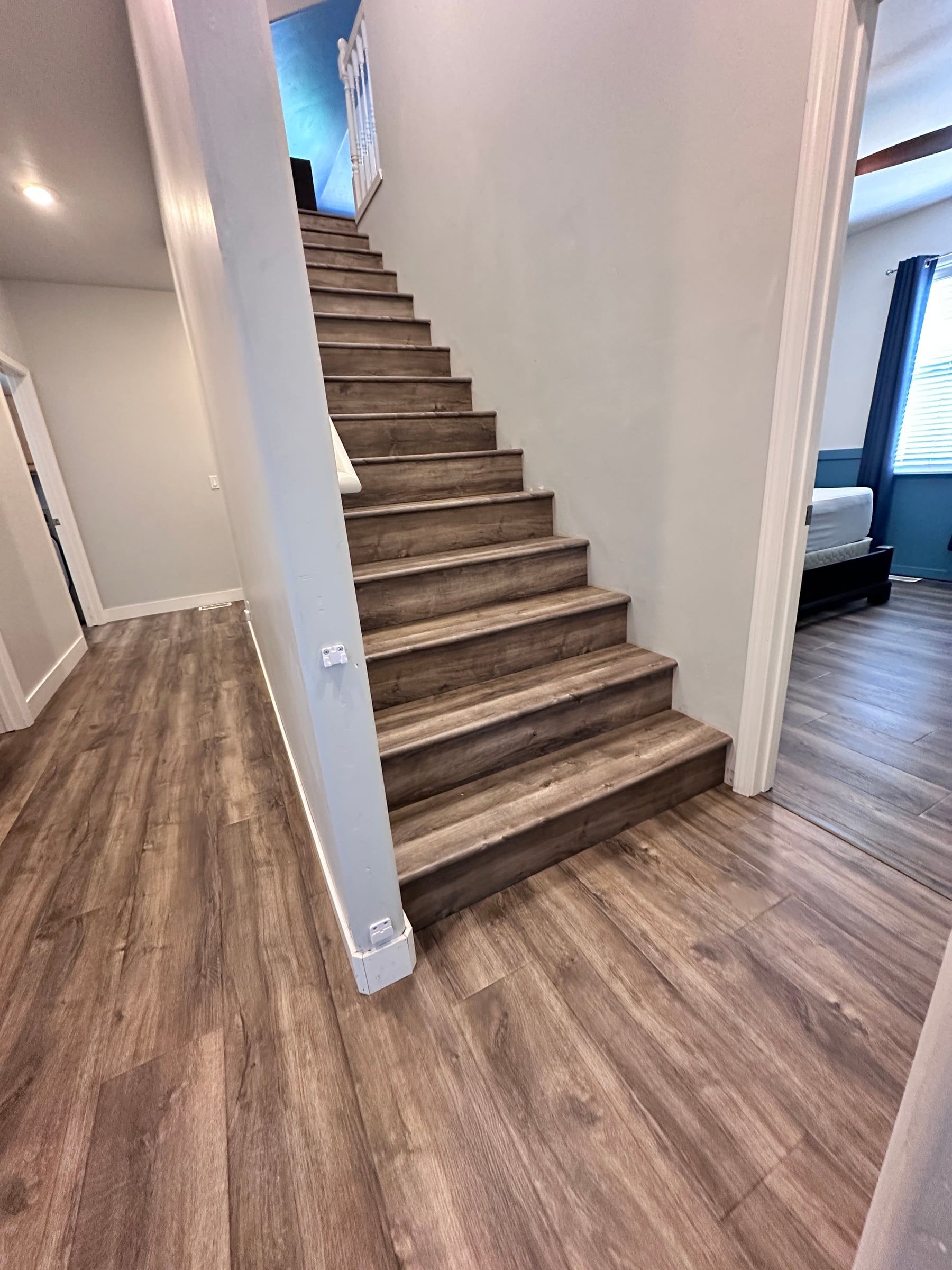 Luxury vinyl plank stairs with matching nosing