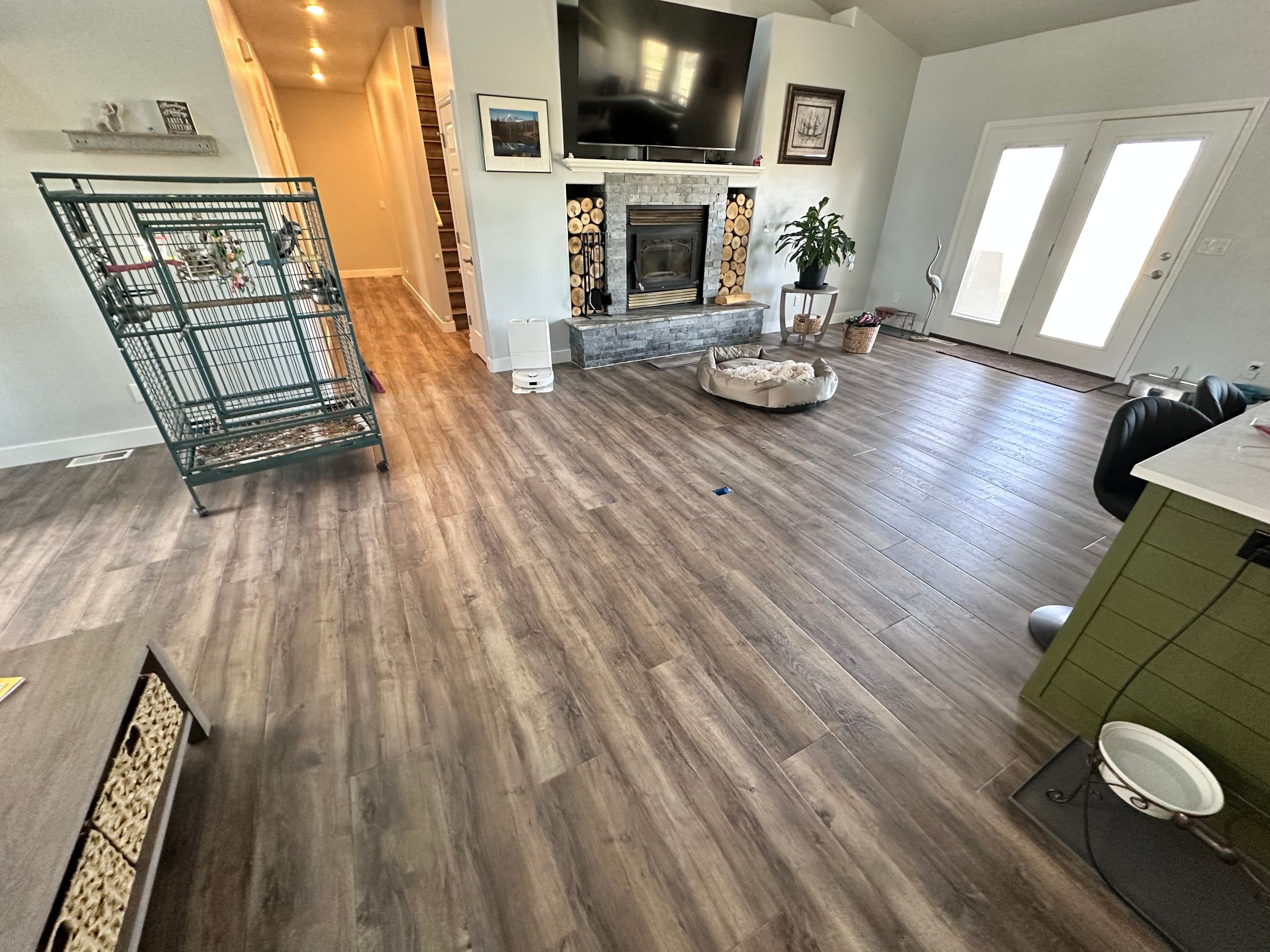 Luxury vinyl plank installed through an open living room